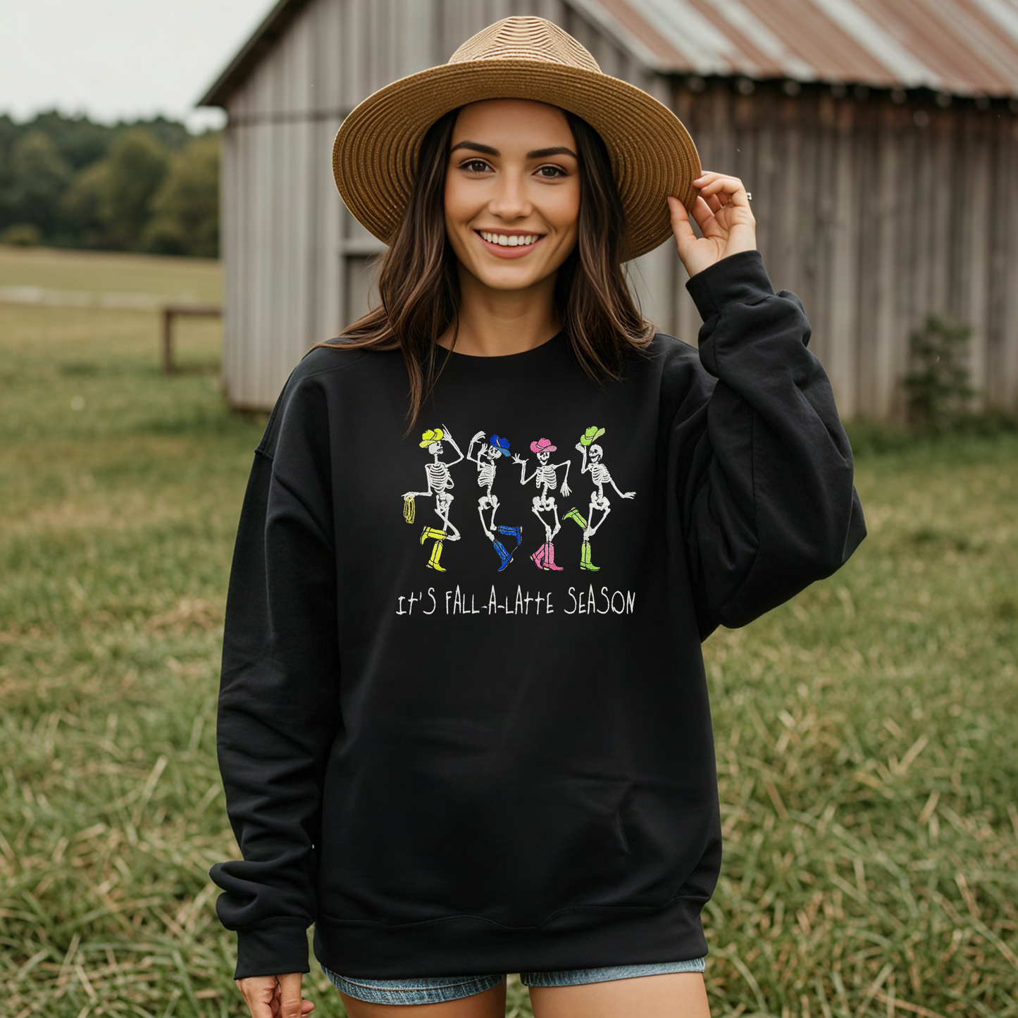Model wearing glow-in-the-dark fall hoodie outdoors in autumn leaves