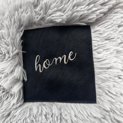 “HOME” Embroidered Patch Blanket – Non-Shedding Faux Fur Throw with Vegan Leather Patch
